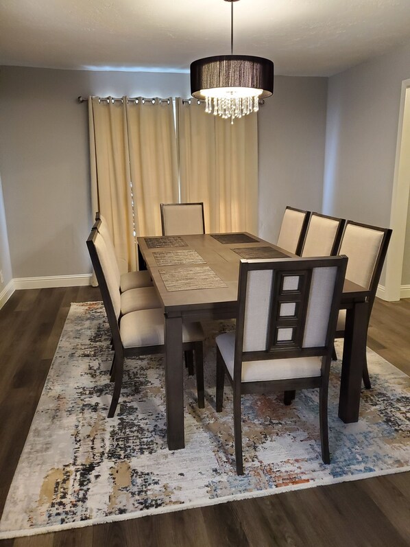 Enjoy meals in this dining area with a rectangular table and four comfortable chairs.