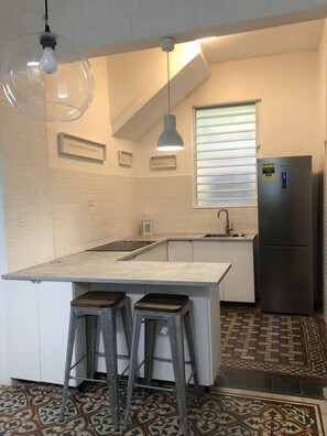 Fridge, microwave, stovetop, coffee/tea maker