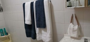 Shower, hair dryer, towels, soap