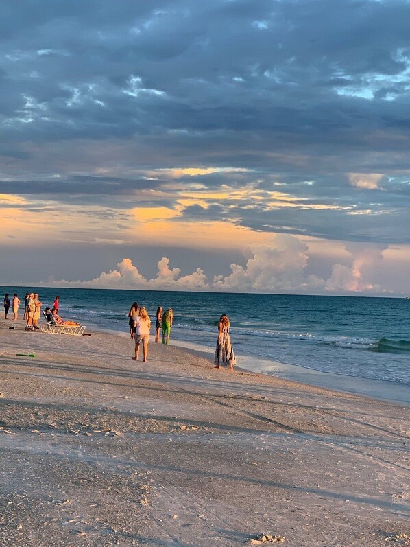 Guests can enjoy a serene beach experience with gentle waves and a pebbly shore.