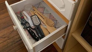 A kitchen drawer with various utensils and a grater. - Costa Rica: Studio Close to EVERYTHING (Heredia)