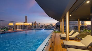 Outdoor pool, open 6:00 AM to 9:00 PM, pool loungers