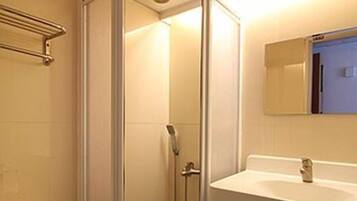 Quadruple Room (4T) | Bathroom | Shower, hair dryer, slippers, towels