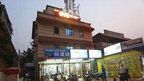 A building with multiple storefronts, including a gallery and a tile shop. - Chilika Residency (Bhubaneshwar)