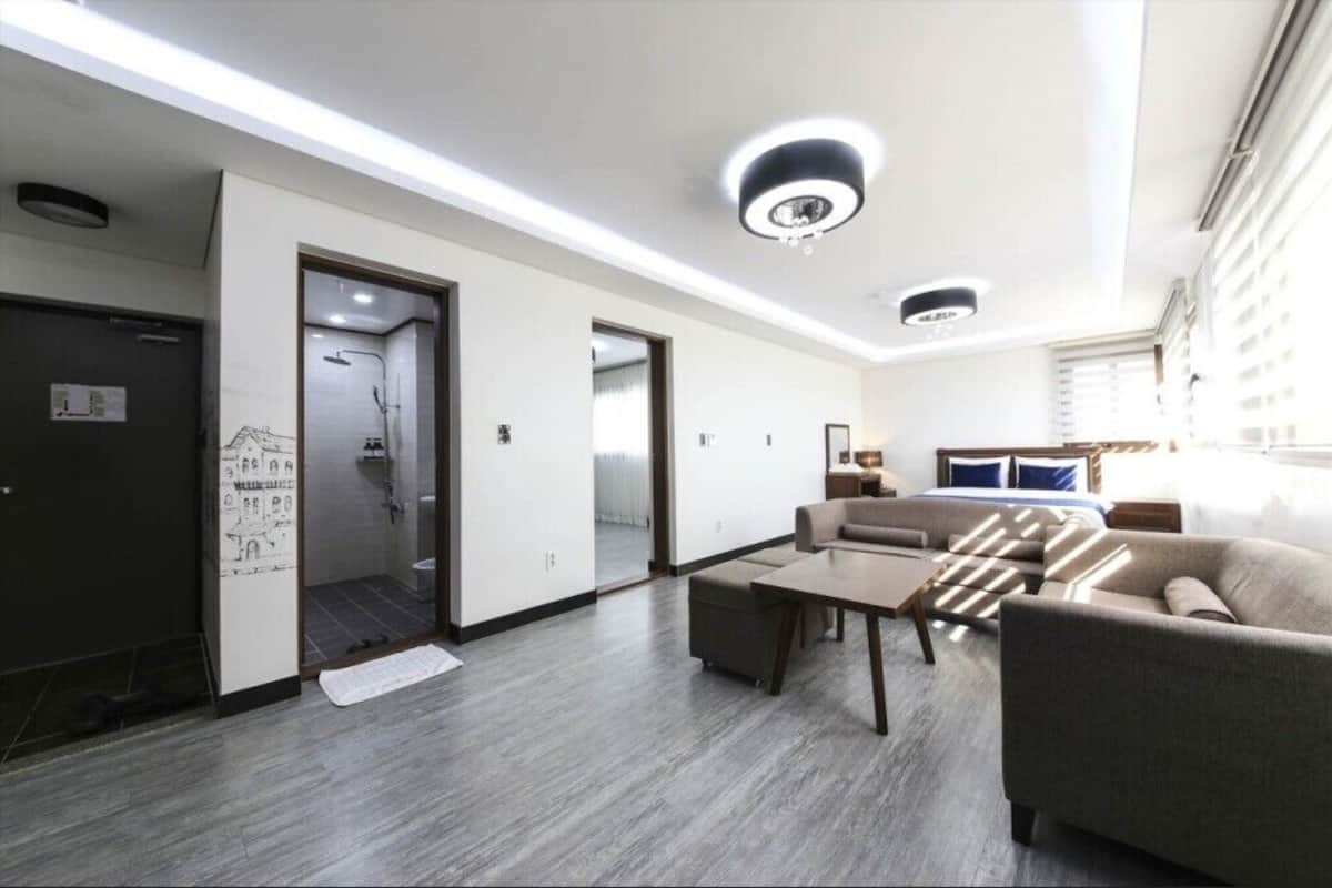 room (superior family) | living area | flat-screen tv