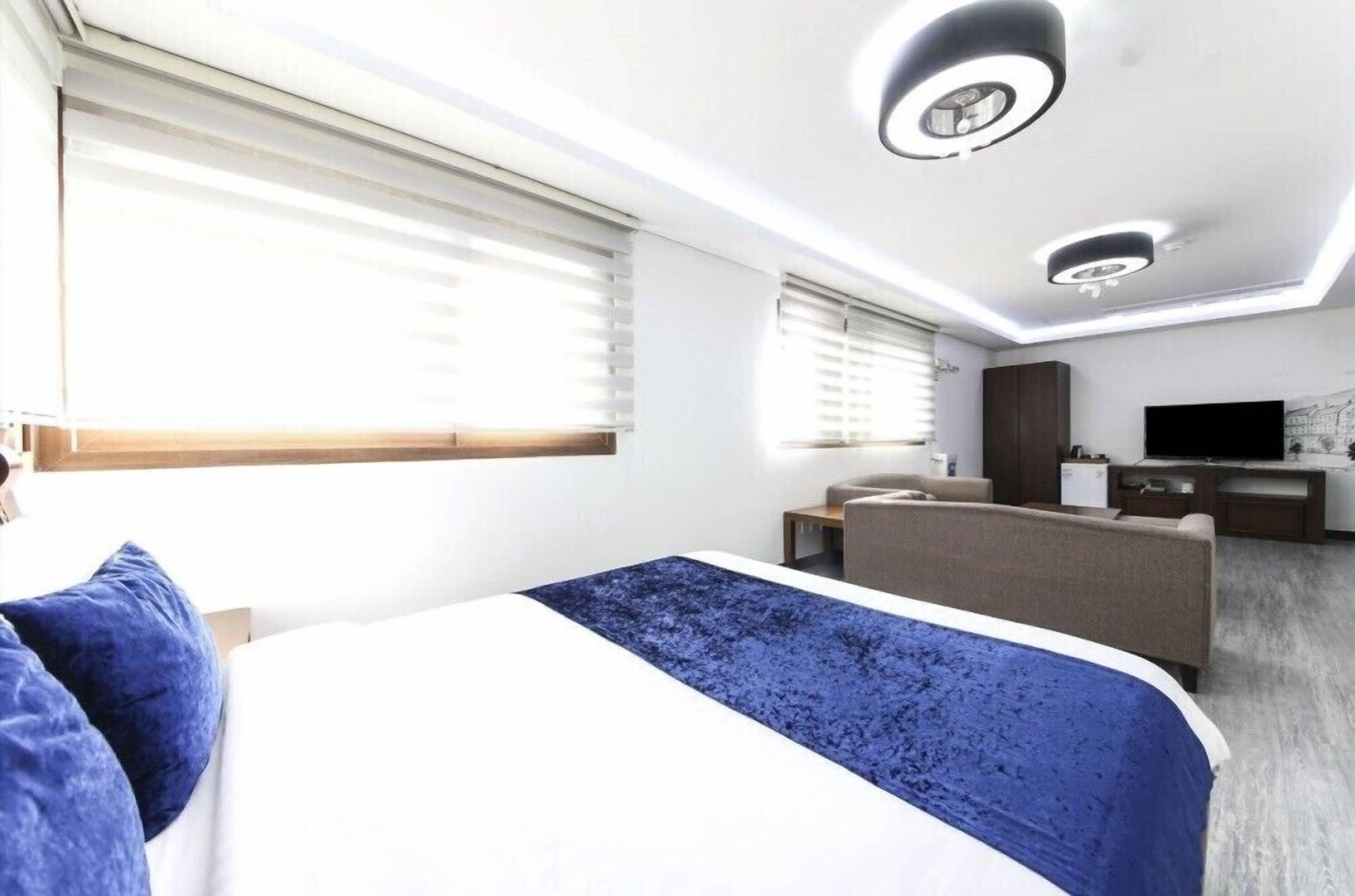 room (superior family) | living area | flat-screen tv