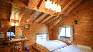 A wooden cabin bedroom with two beds, a desk, a chair, and a window. - Cloud Falls Resort (Ren'ai)