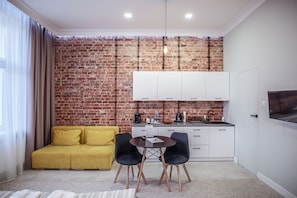 Deluxe Studio Suite, 1 Bedroom, Non Smoking, Kitchenette | Free minibar, desk, iron/ironing board, free WiFi - Gruda Apartments (Kwidzyn)