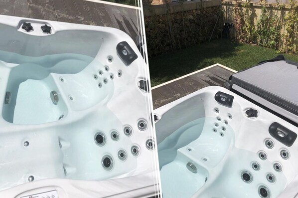 Two hot tubs with multiple jets, a control panel, and a stone wall in the background.