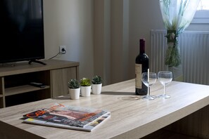 Apartment, 1 Bedroom | Living area | Flat-screen TV