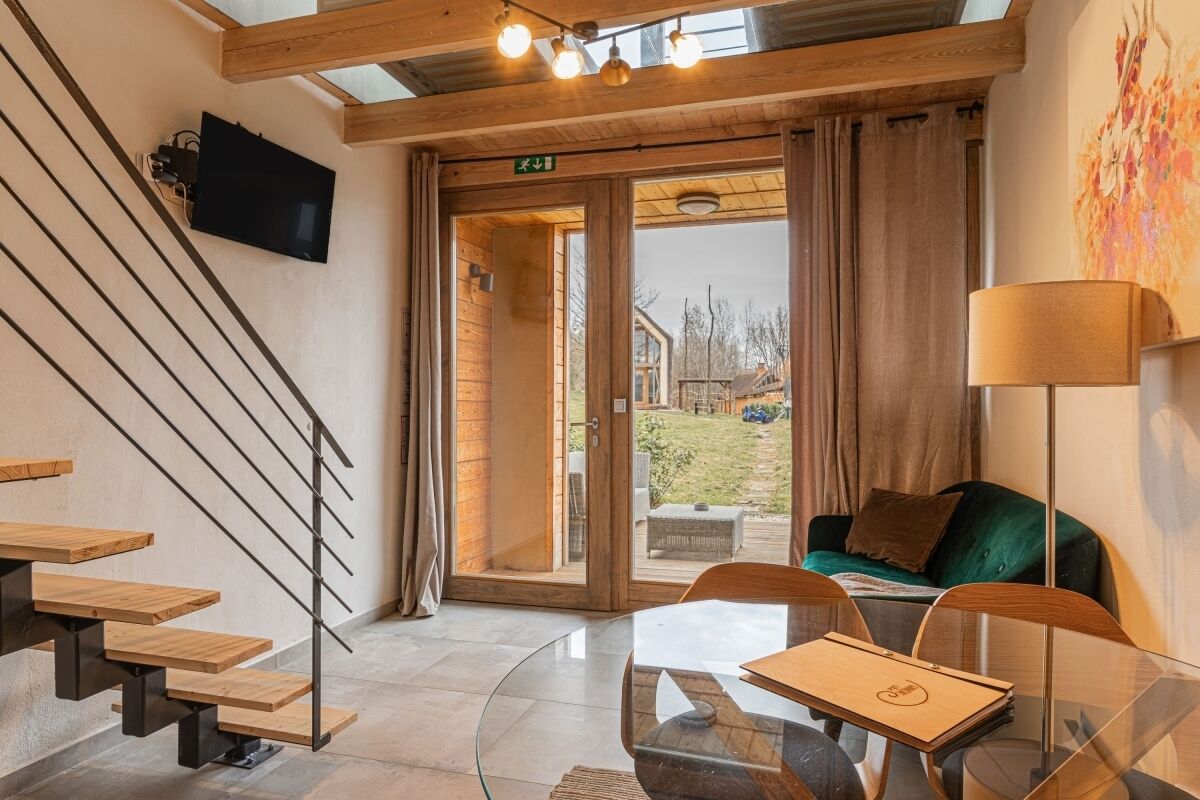 Casa de lujo, varias camas, vista al jardín | Área de sala de estar | Chimenea 