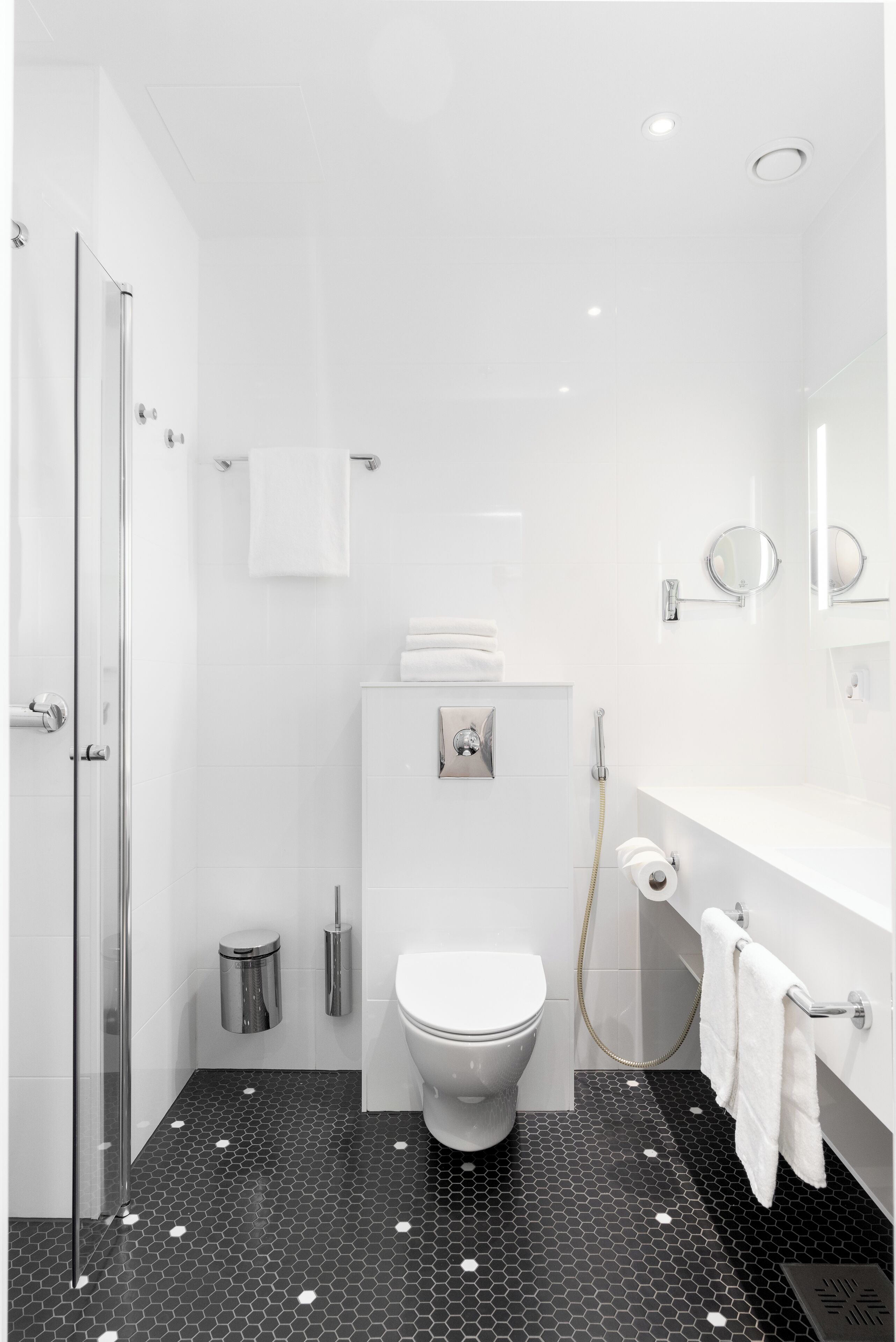 standard twin room | bathroom | shower, eco-friendly toiletries, hair dryer, towels