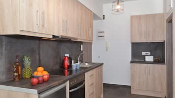 Estúdio | Cozinha privada | Frigobar, fogão, cooktop, chaleira elétrica