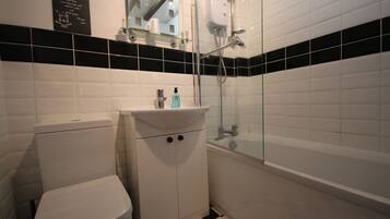 Combined shower/tub, hair dryer, towels, soap