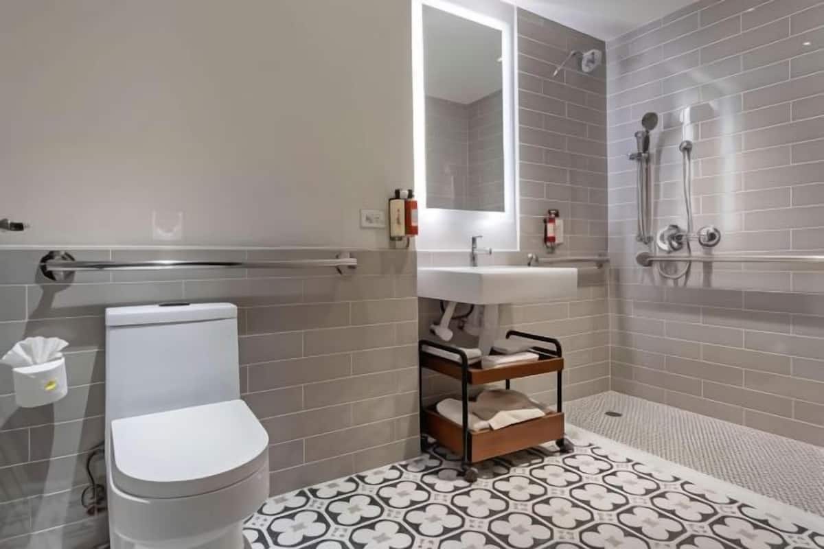 Bathroom | Designer toiletries, hair dryer, towels, soap