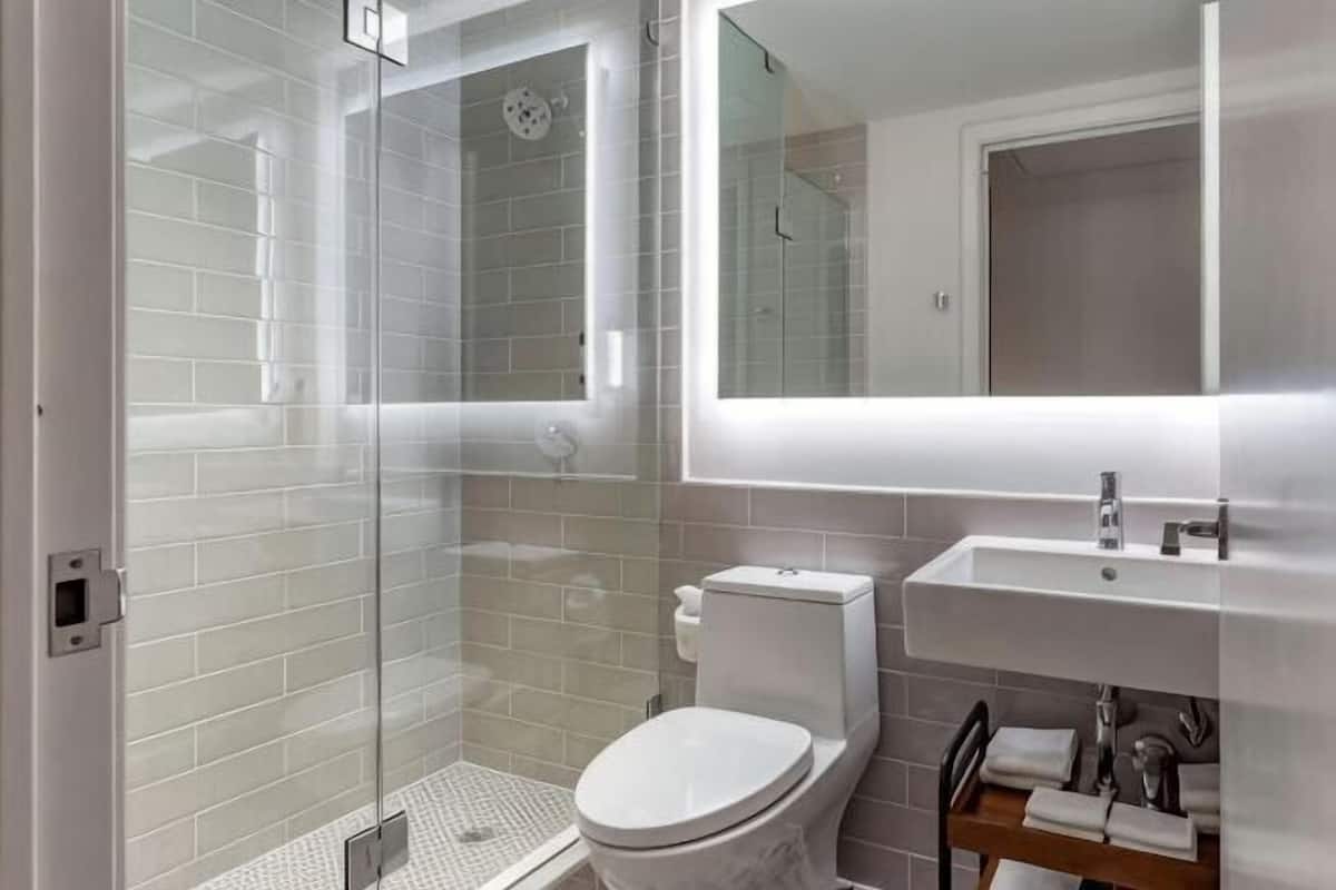Bathroom | Designer toiletries, hair dryer, towels, soap