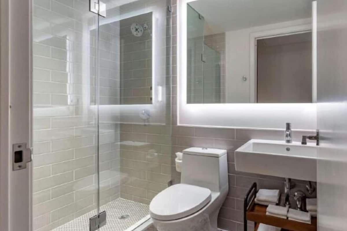 Designer toiletries, hair dryer, towels, soap