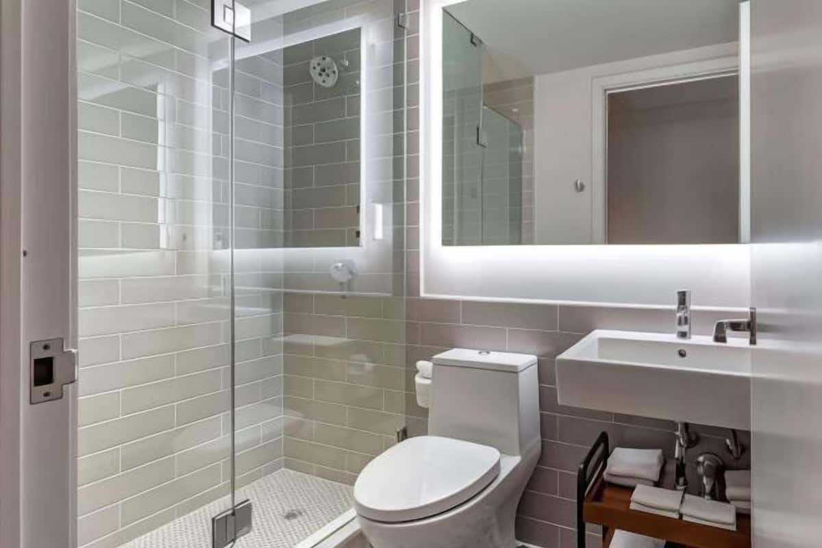 Bathroom | Designer toiletries, hair dryer, towels, soap