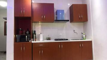 Microwave, coffee/tea maker, cookware/dishes/utensils