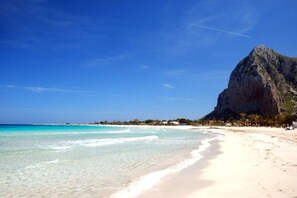 On the beach, sun loungers, beach towels