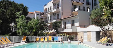 Seasonal outdoor pool, pool loungers