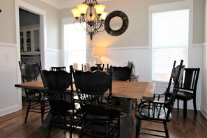 Enjoy meals in this dining area with a wooden table and six comfortable chairs.
