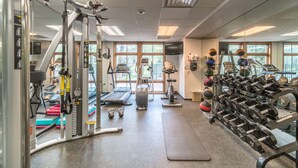 A gym with exercise equipment, treadmills, and weights. - A+ Base Area Condo | Zephyr Mountain Lodge | Mountain Views | New Decor | Ski In Ski Out (Winter Park)