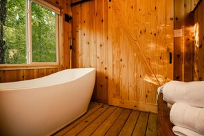 Bathtub, hair dryer, towels, soap