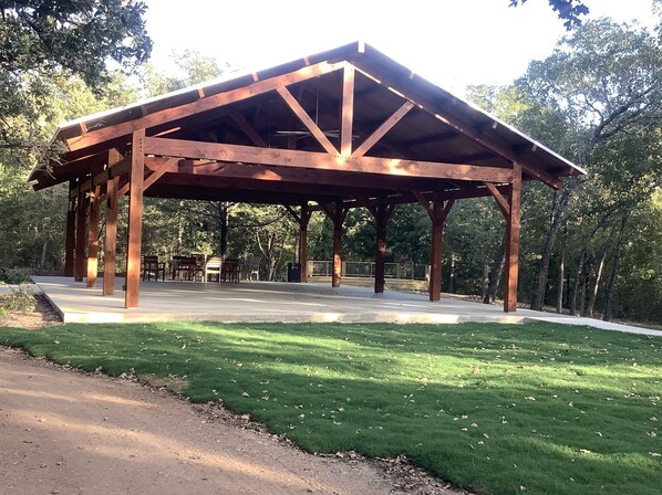 Situated in a well-maintained grassy area, this pavilion offers benches for relaxation and social gatherings.