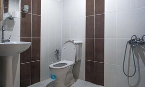 Shower, hair dryer, slippers, towels