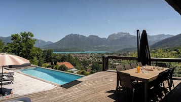 A heated pool, pool loungers