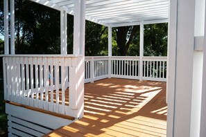 Enjoy unobstructed views of the surrounding greenery from this open-air deck.