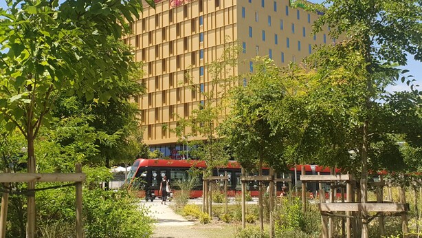 A building with a sign reading "Crown Plaza."