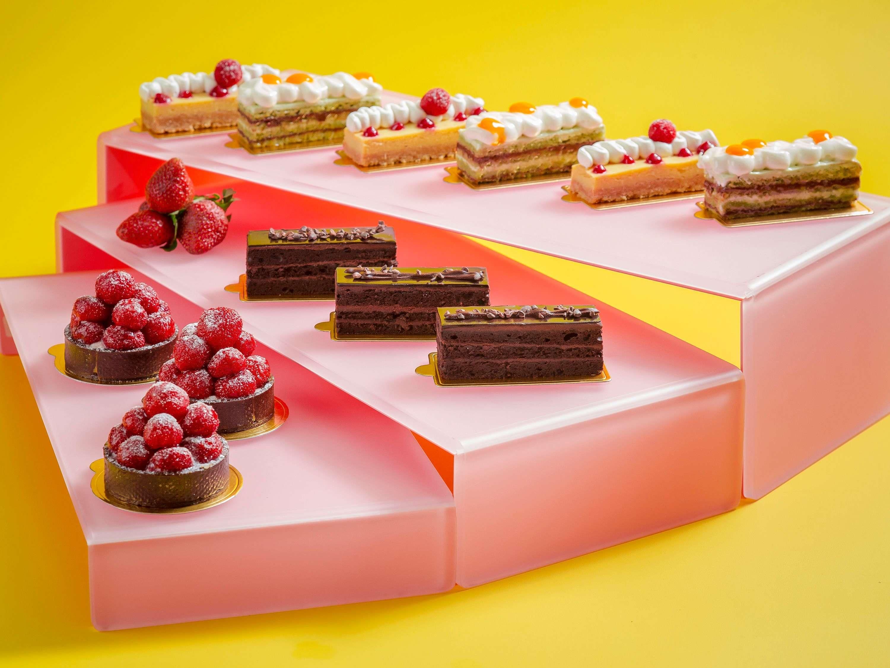 A tiered display of various desserts.