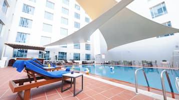 Outdoor pool, open 7:00 AM to 6:00 PM, pool loungers