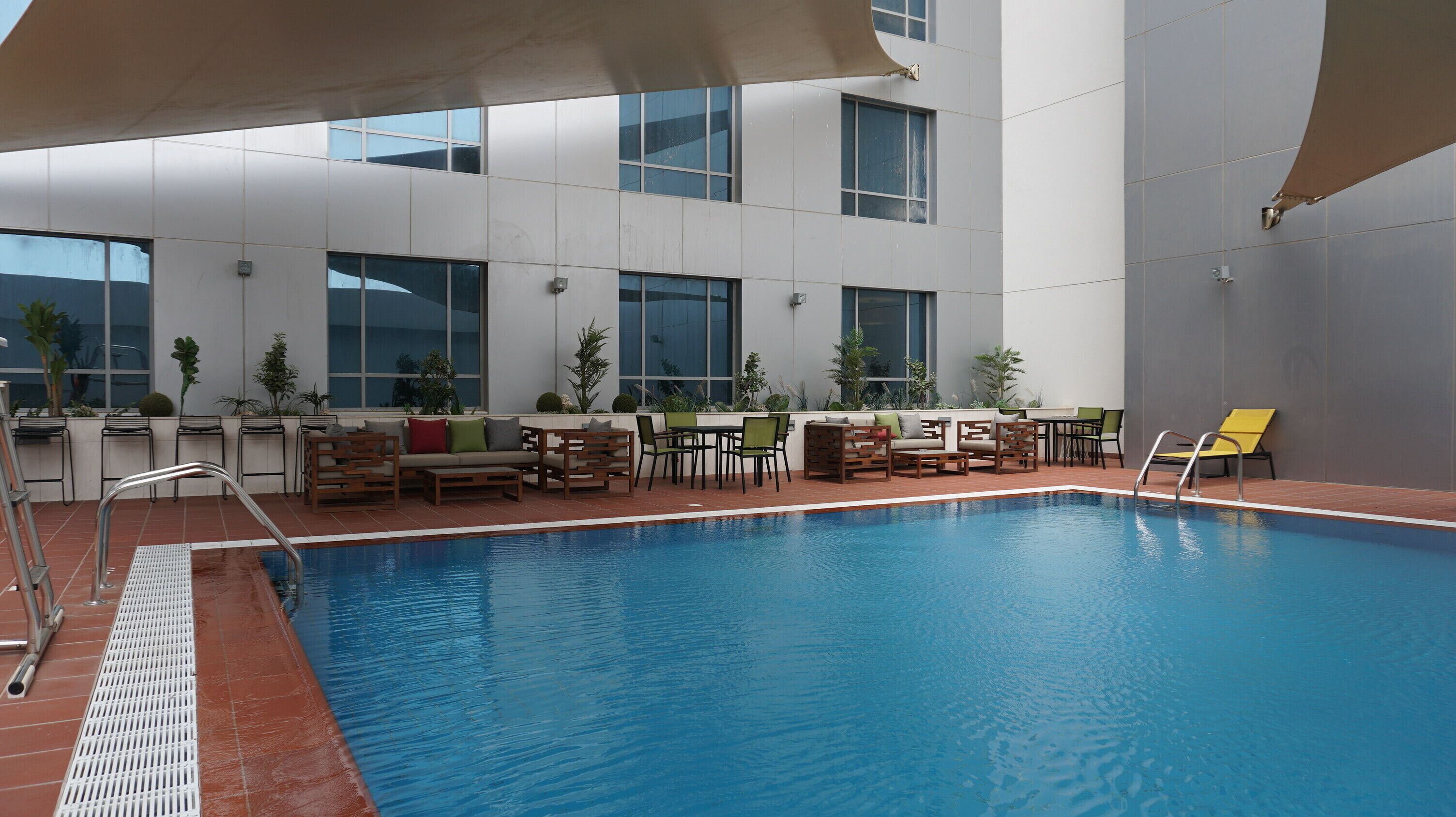outdoor pool, open 7:00 am to 6:00 pm, pool loungers