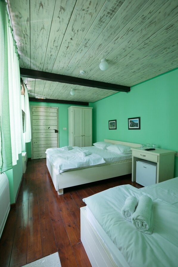 Triple Room | Minibar, desk, laptop workspace, blackout drapes