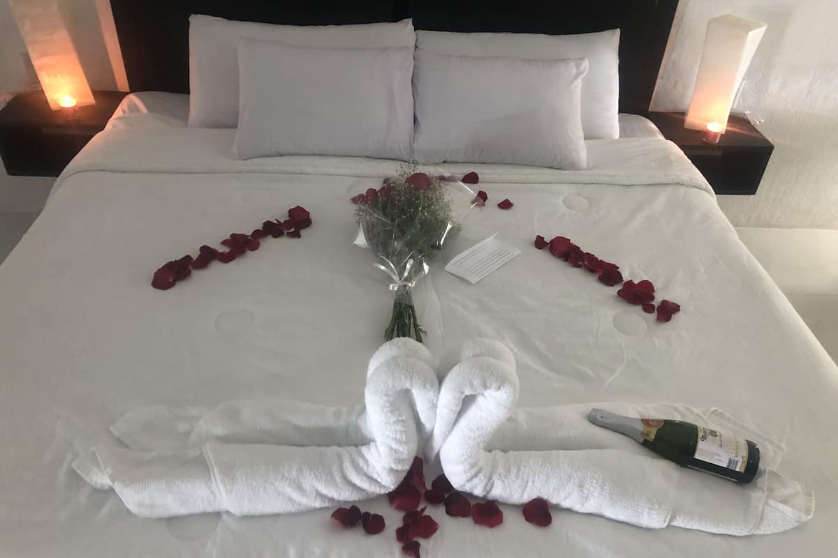 Deluxe Quadruple Room | Premium bedding, down comforters, Select Comfort beds, in-room safe