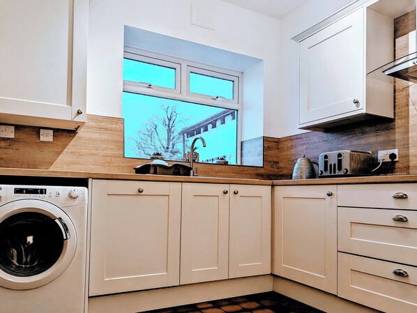 Oven, dishwasher, high chair, cookware/dishes/utensils
