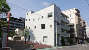 A modern multi-story building with a flat facade, large windows, and a visible entrance. - Higashi-Gokencho M-building 2F (Tokyo)