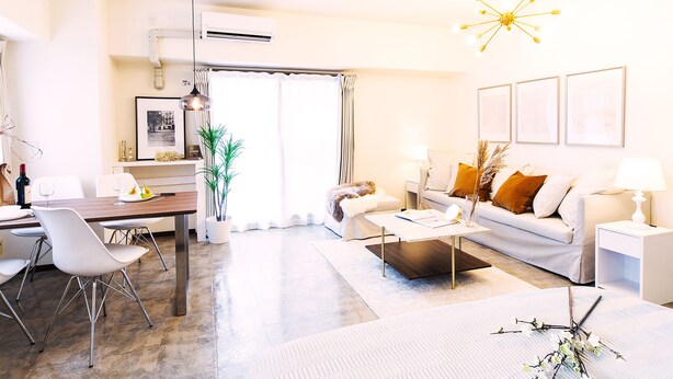 A modern living room with a dining area, white furniture, and a large window with curtains. - City Hotel Namba Ⅱ (Osaka)