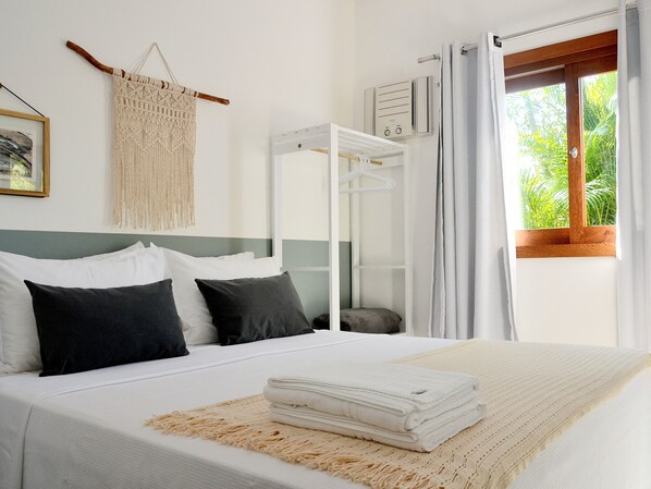 Standard Suite, 1 Queen Bed | Individually decorated, iron/ironing board, bed sheets