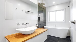 Bathtub, hair dryer, towels