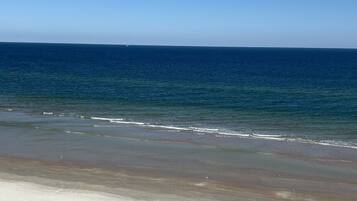 On the beach, sun loungers, beach towels