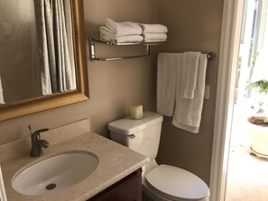 Combined shower/bathtub, hair dryer, towels, soap