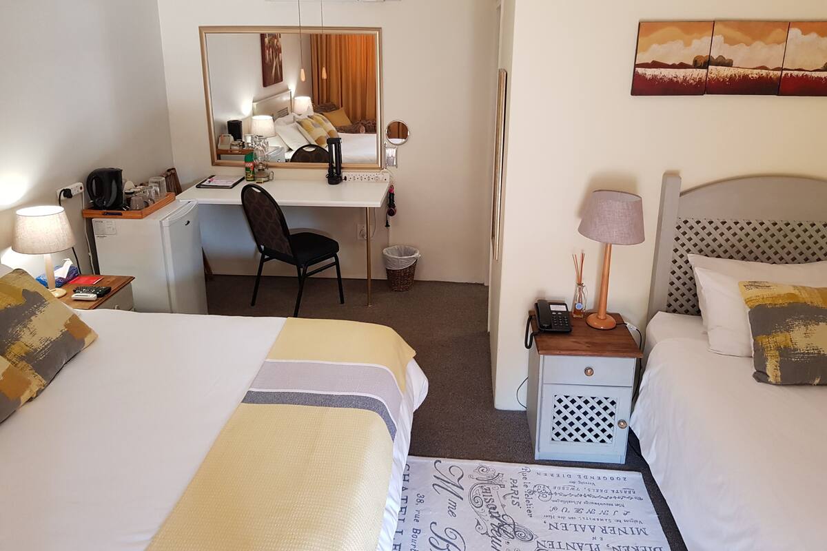 Family Triple Room | In-room safe, individually decorated, desk, blackout drapes