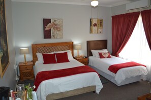Family Triple Room | In-room safe, individually decorated, desk, blackout drapes