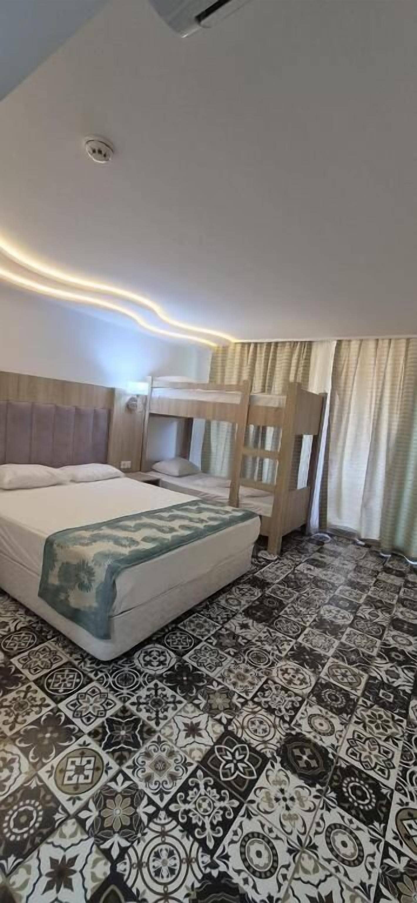 Superior Quadruple Room, Pool View | Minibar, in-room safe, desk, laptop workspace