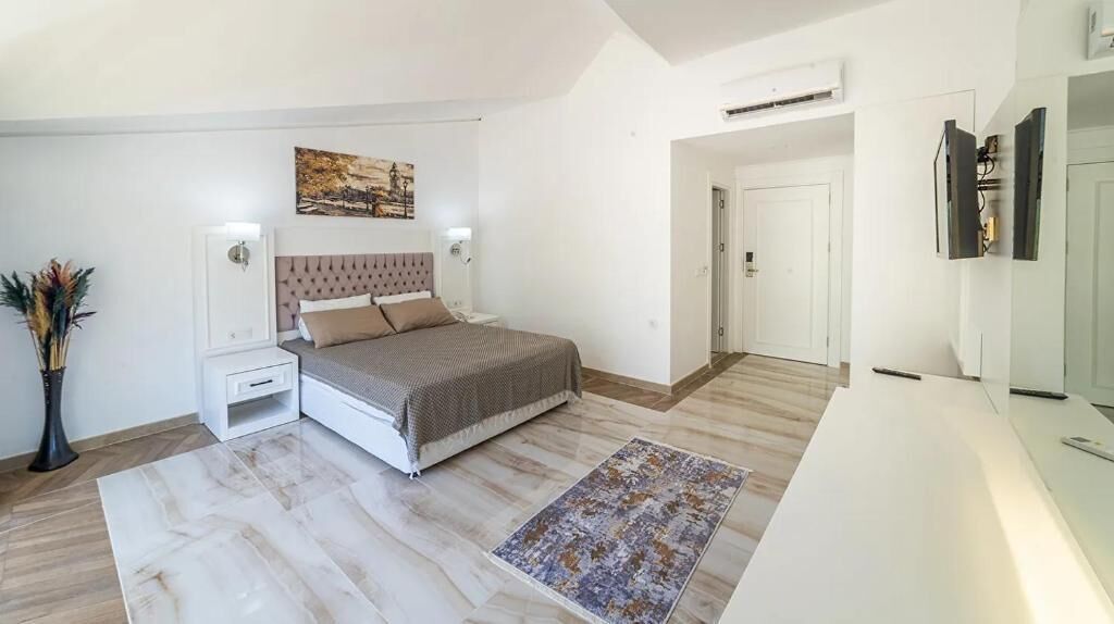 Family Quadruple Room, Garden View | Minibar, in-room safe, desk, laptop workspace