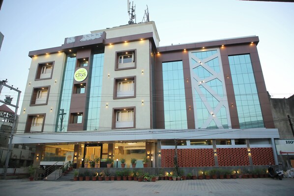 A hotel with a modern facade, large windows, and a prominent 'Hotel Cirrus Prime' sign. - Hotel Citrus Prime (Raipur)